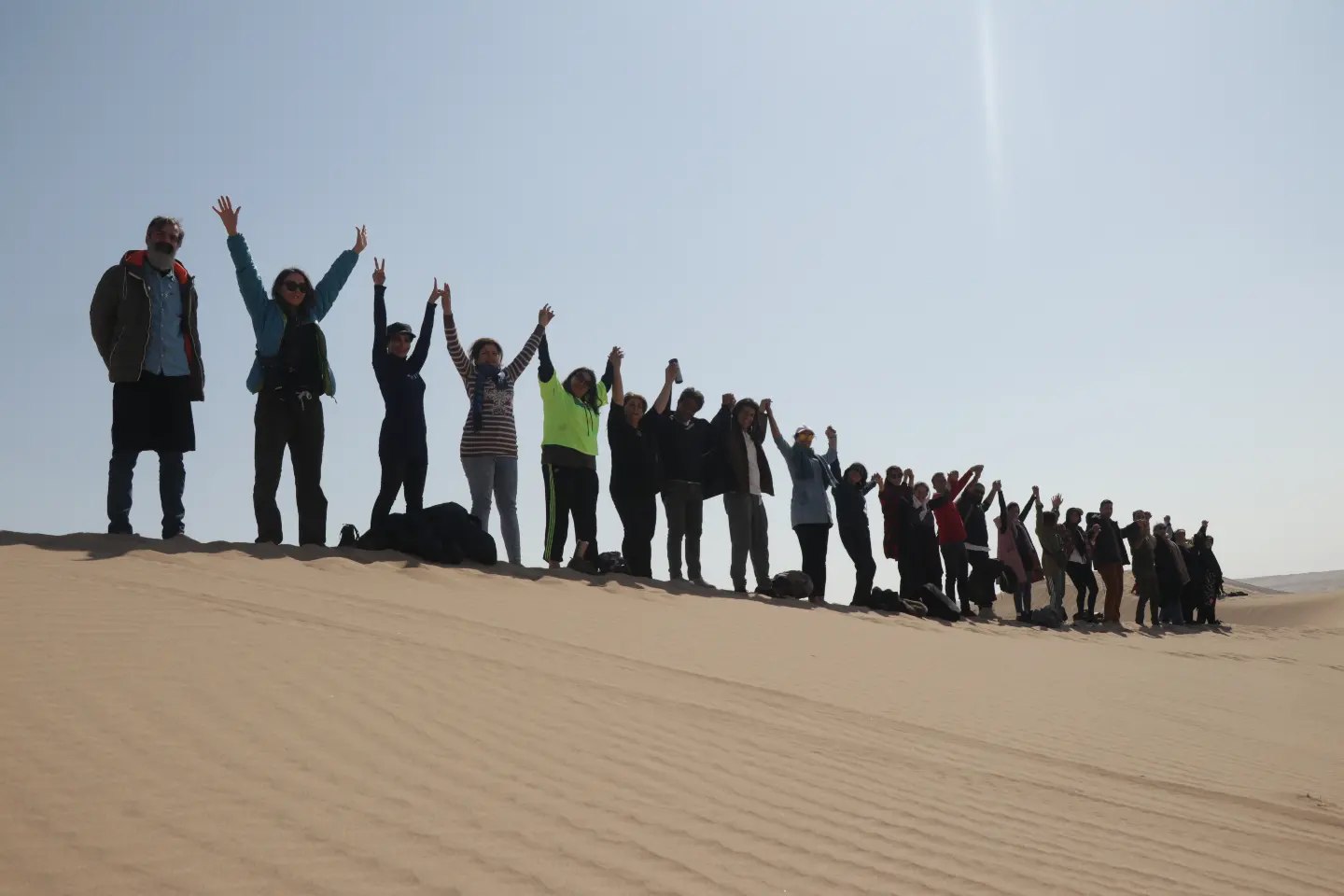 Retreat group celebrating together on the dunes
